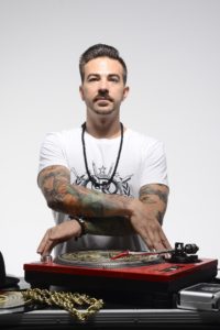 Arturo Alvarez Demalde shows off his DJ skills on the turntable